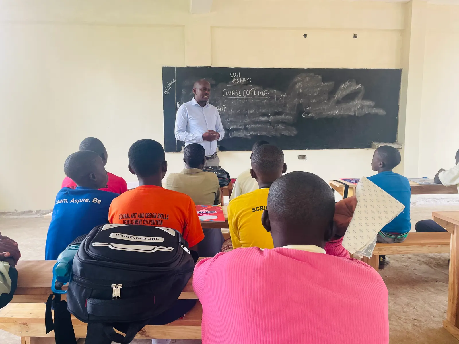 Teachers and students working together at the school